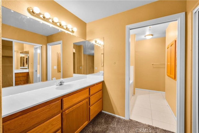 58957 Pueblo Trl, Yucca Valley, CA 92284 - full bathroom with vanity, baseboards, a washtub, and tile patterned floors