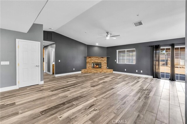 58957 Pueblo Trl, Yucca Valley, CA 92284 - unfurnished living room featuring ceiling fan, baseboards, lofted ceiling, light wood-type flooring, and visible vents