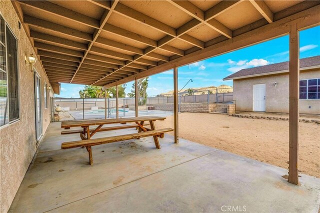 58957 Pueblo Trl, Yucca Valley, CA 92284 - view of patio / terrace featuring a fenced backyard