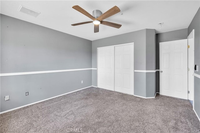 58957 Pueblo Trl, Yucca Valley, CA 92284 - unfurnished bedroom featuring visible vents, a closet, baseboards, ceiling fan, and carpet
