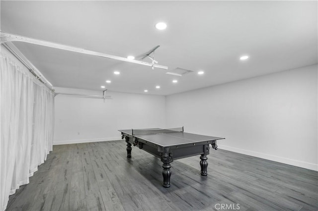 game room featuring baseboards, recessed lighting, and wood finished floors