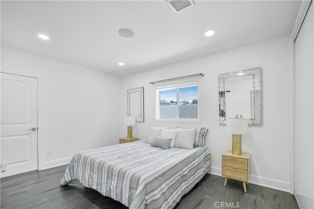 bedroom with visible vents, recessed lighting, baseboards, and dark wood-style floors