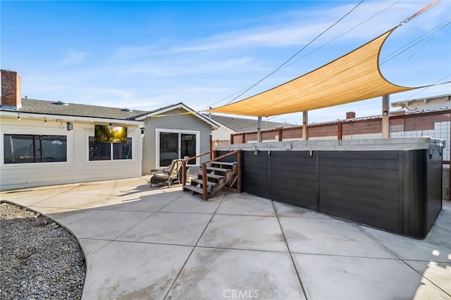view of patio featuring fence