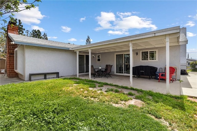 9684 Hemlock St, Rancho Cucamonga, CA 91730 - back of property with stucco siding, a chimney, and a patio area