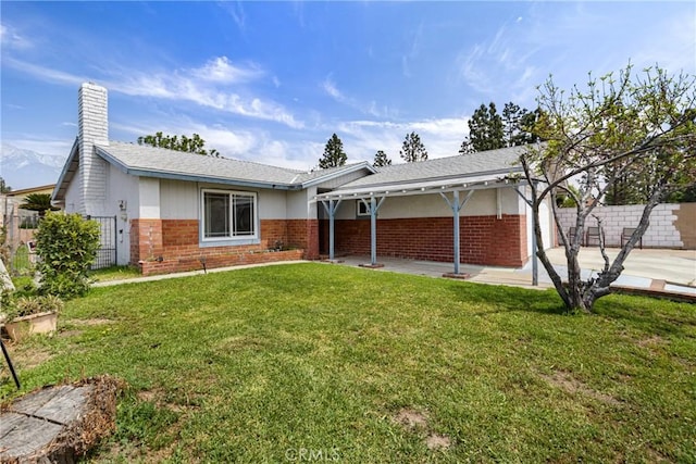 9684 Hemlock St, Rancho Cucamonga, CA 91730 - back of house featuring a patio, brick siding, and a garage
