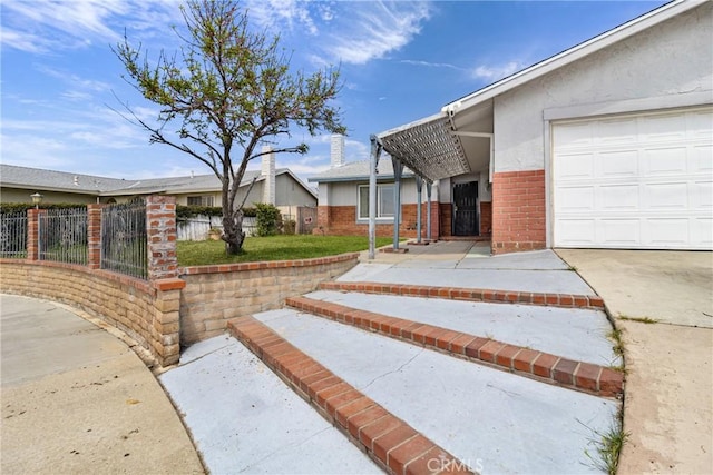 9684 Hemlock St, Rancho Cucamonga, CA 91730 - view of front facade with brick siding, an attached garage, and stucco siding