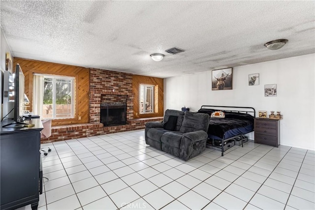 9684 Hemlock St, Rancho Cucamonga, CA 91730 - living area with wood walls, a textured ceiling, a brick fireplace, and light tile patterned floors
