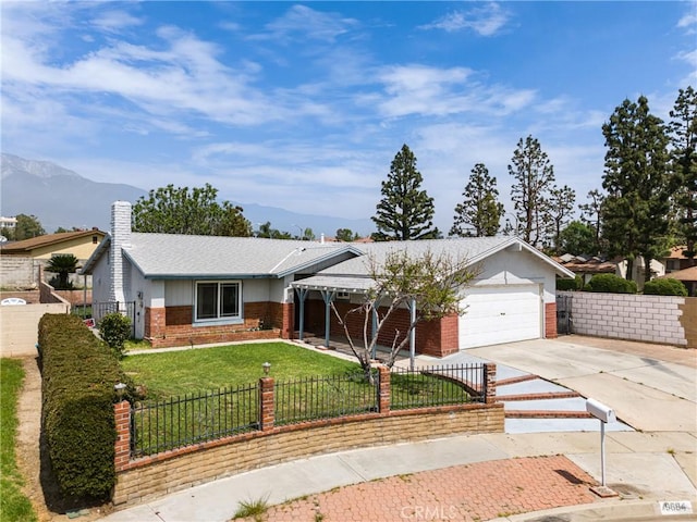 9684 Hemlock St, Rancho Cucamonga, CA 91730 - ranch-style home featuring brick siding, a fenced front yard, an attached garage, driveway, and a mountain view