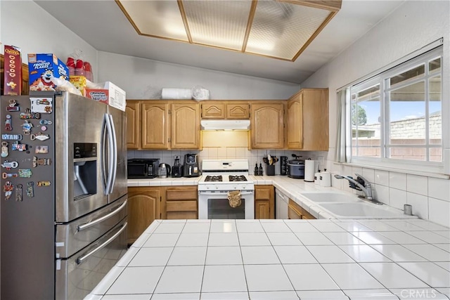 9684 Hemlock St, Rancho Cucamonga, CA 91730 - kitchen with stainless steel refrigerator with ice dispenser, white gas range oven, tile counters, under cabinet range hood, and vaulted ceiling
