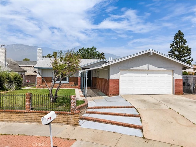 9684 Hemlock St, Rancho Cucamonga, CA 91730 - view of front of house featuring brick siding, a mountain view, driveway, and an attached garage