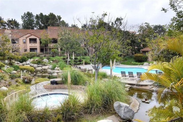 view of home's community with a swimming pool