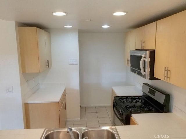 1052 Calle Del Cerro Unit 705, San Clemente, CA 92672 - kitchen featuring appliances with stainless steel finishes, a sink, recessed lighting, light tile patterned floors, and baseboards