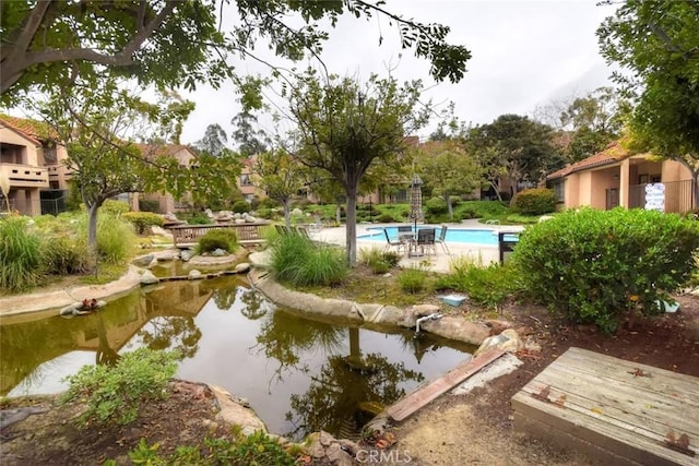 surrounding community with a pool