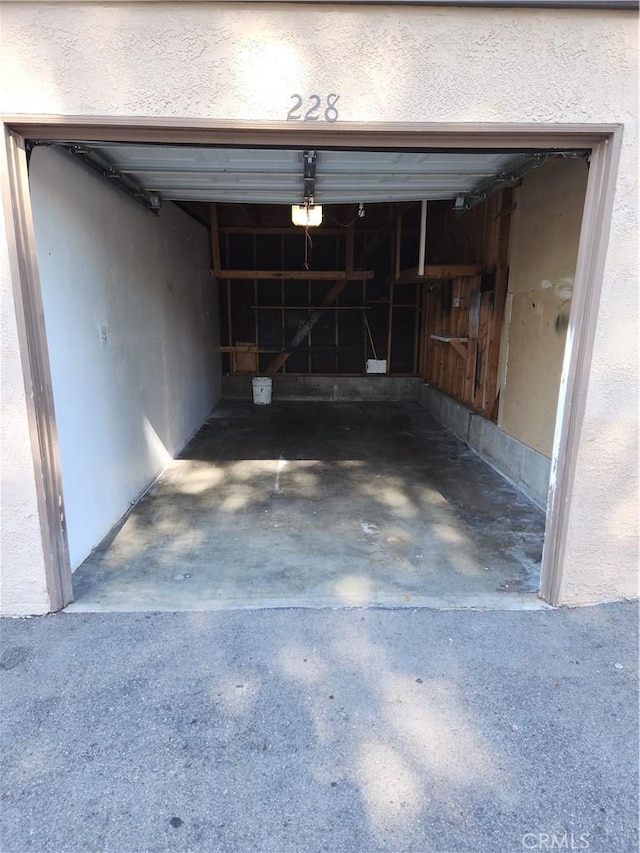 1052 Calle Del Cerro Unit 705, San Clemente, CA 92672 - garage with a garage door opener and concrete driveway