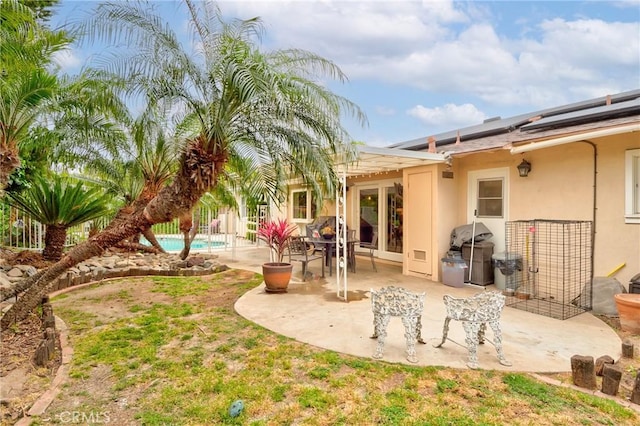 1528 E San Alto Ave, Orange, CA 92865 - back of house with a patio, solar panels, an outdoor pool, and stucco siding