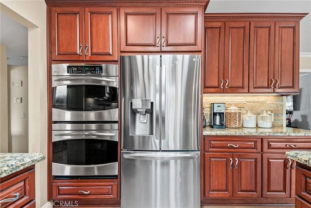 1528 E San Alto Ave, Orange, CA 92865 - kitchen with appliances with stainless steel finishes, decorative backsplash, and light stone counters
