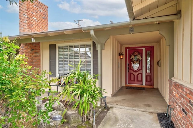 1528 E San Alto Ave, Orange, CA 92865 - view of exterior entry with brick siding and a chimney