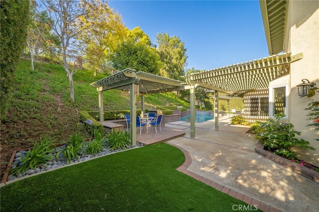 view of yard featuring a pergola, an outdoor pool, and a patio area