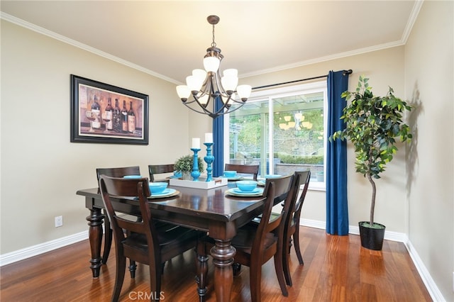 dining area featuring dark wood-style flooring, baseboards, an inviting chandelier, and ornamental molding