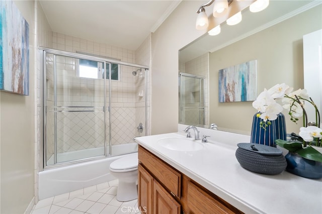 full bath with crown molding, tile patterned flooring, vanity, bath / shower combo with glass door, and toilet