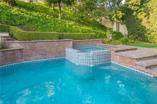 outdoor pool with an in ground hot tub
