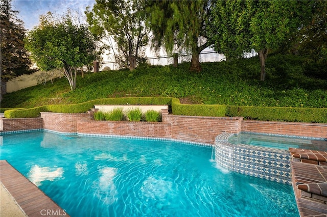 pool with an in ground hot tub