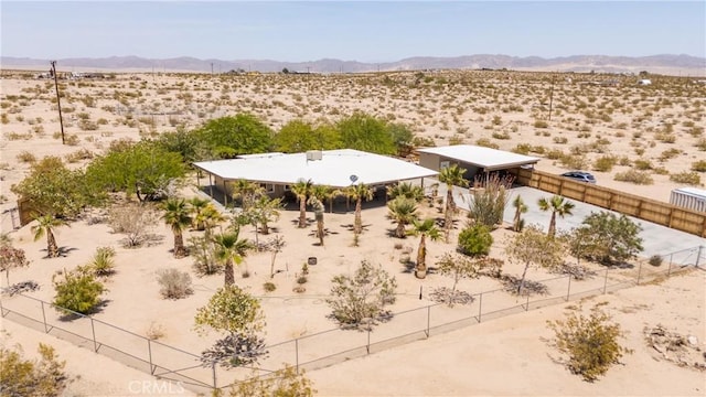 bird's eye view featuring a rural view, a mountain view, and a desert view
