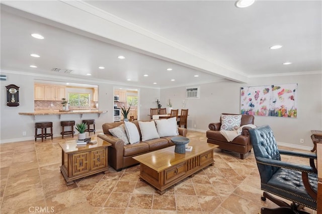 living room with crown molding, recessed lighting, and visible vents