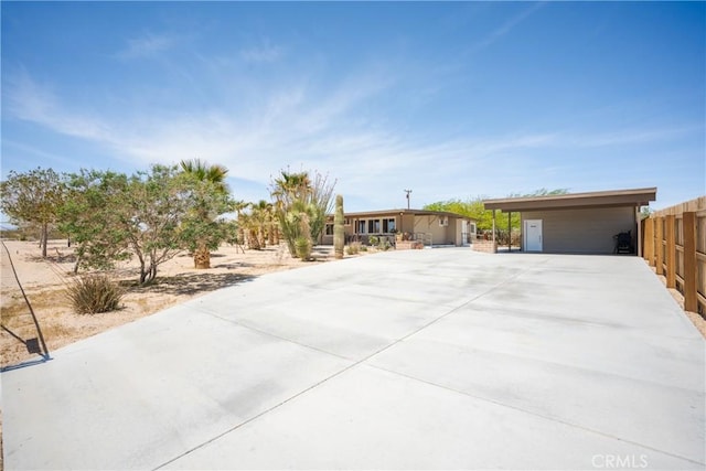 ranch-style home with fence