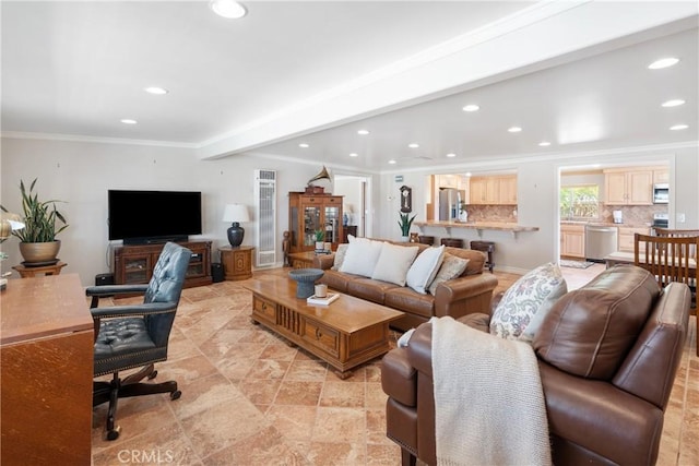 living room with crown molding and recessed lighting