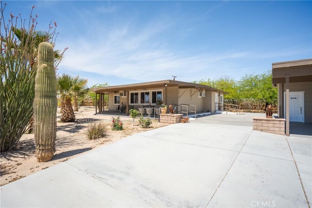 manufactured / mobile home with a patio