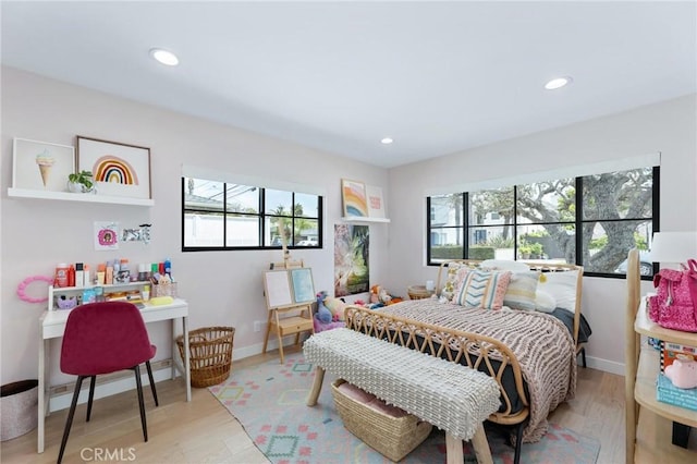 bedroom featuring recessed lighting, baseboards, and wood finished floors