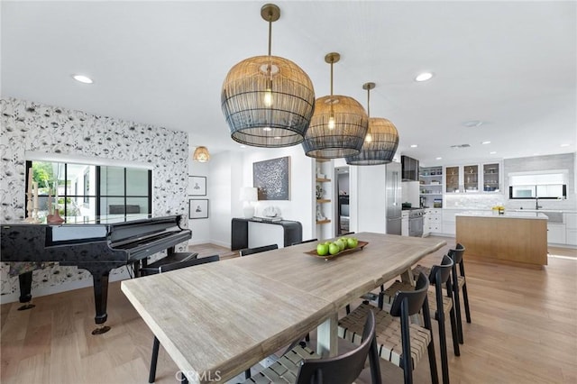 dining room featuring light wood-style flooring and recessed lighting