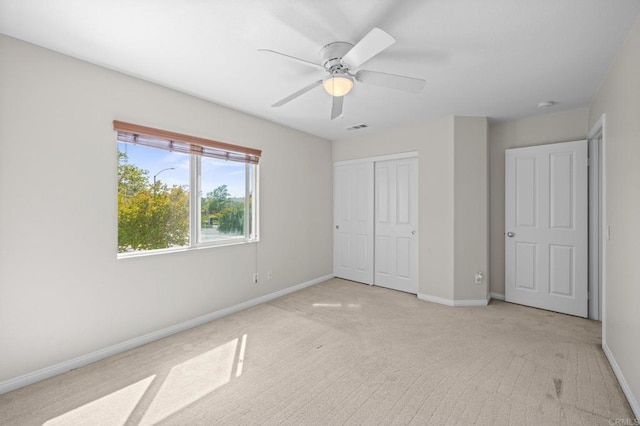 28829 Golden Dawn Dr, Menifee, CA 92584 - unfurnished bedroom featuring light carpet, a ceiling fan, baseboards, visible vents, and a closet