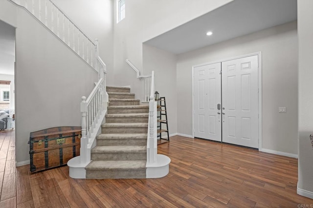 28829 Golden Dawn Dr, Menifee, CA 92584 - entryway featuring baseboards, stairs, and wood finished floors