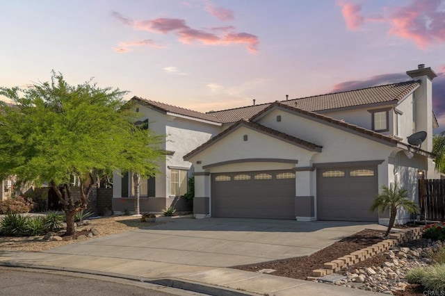 28829 Golden Dawn Dr, Menifee, CA 92584 - mediterranean / spanish house with stucco siding, a tiled roof, driveway, and a garage