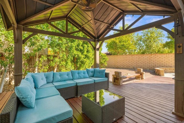 28829 Golden Dawn Dr, Menifee, CA 92584 - wooden terrace with fence, a gazebo, and an outdoor living space