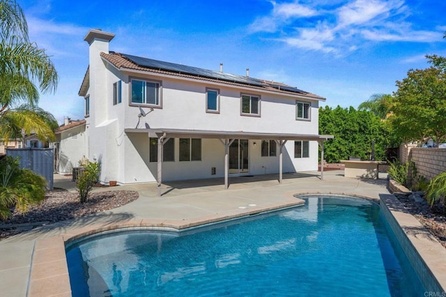 28829 Golden Dawn Dr, Menifee, CA 92584 - back of house featuring a fenced in pool, a fenced backyard, a patio area, and stucco siding