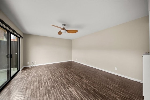 spare room with ceiling fan, baseboards, and dark wood-type flooring