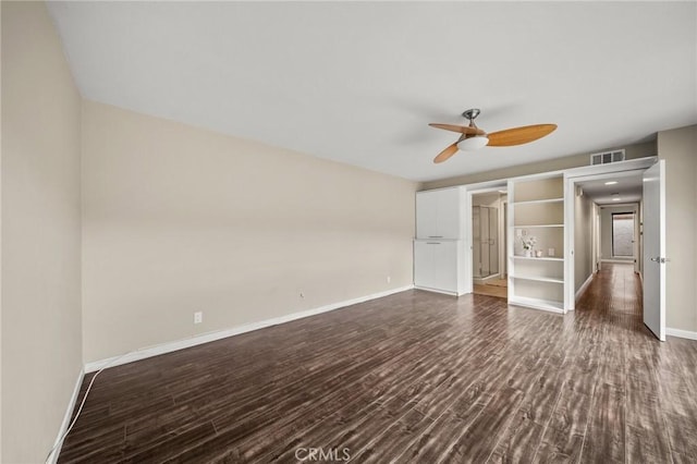 unfurnished bedroom with visible vents, baseboards, a ceiling fan, and dark wood-style floors
