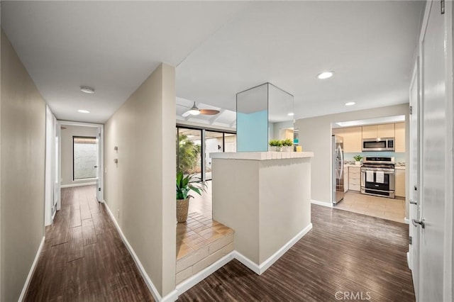 hall with recessed lighting, baseboards, and wood finished floors