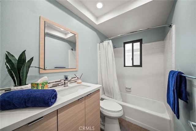 full bathroom featuring toilet, shower / tub combo with curtain, and vanity
