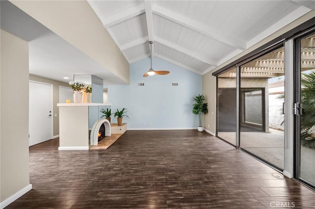 hallway with baseboards, wood finished floors, lofted ceiling with beams, and visible vents