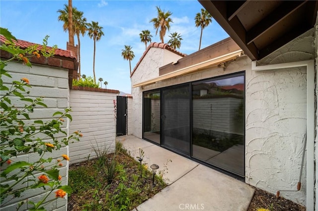 exterior space with fence and stucco siding