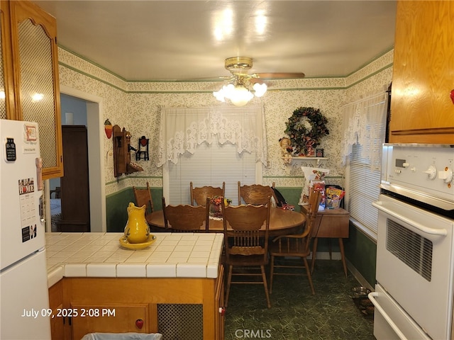 18340 Delicious St, Adelanto, CA 92301 - dining area with wallpapered walls and a ceiling fan