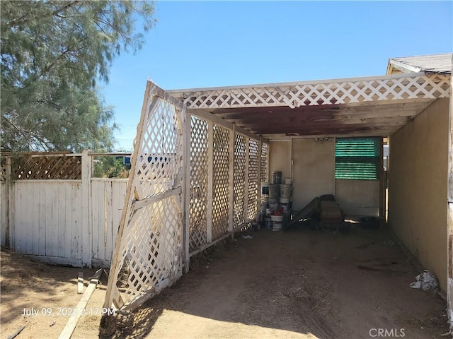 18340 Delicious St, Adelanto, CA 92301 - view of side of property featuring a carport