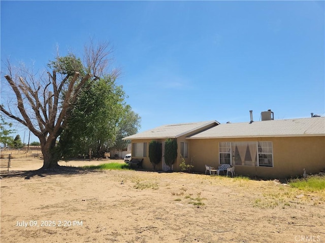 18340 Delicious St, Adelanto, CA 92301 - back of house with stucco siding