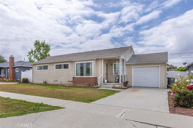 ranch-style home with brick siding, a garage, stucco siding, a front yard, and driveway