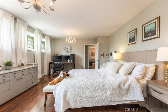 bedroom featuring an inviting chandelier and dark wood-style floors