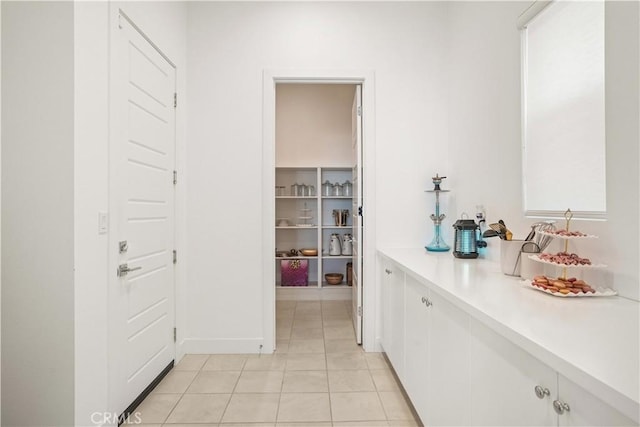 11818 N Hillsborough Ln, Porter Ranch, CA 91326 - corridor featuring light tile patterned floors and baseboards